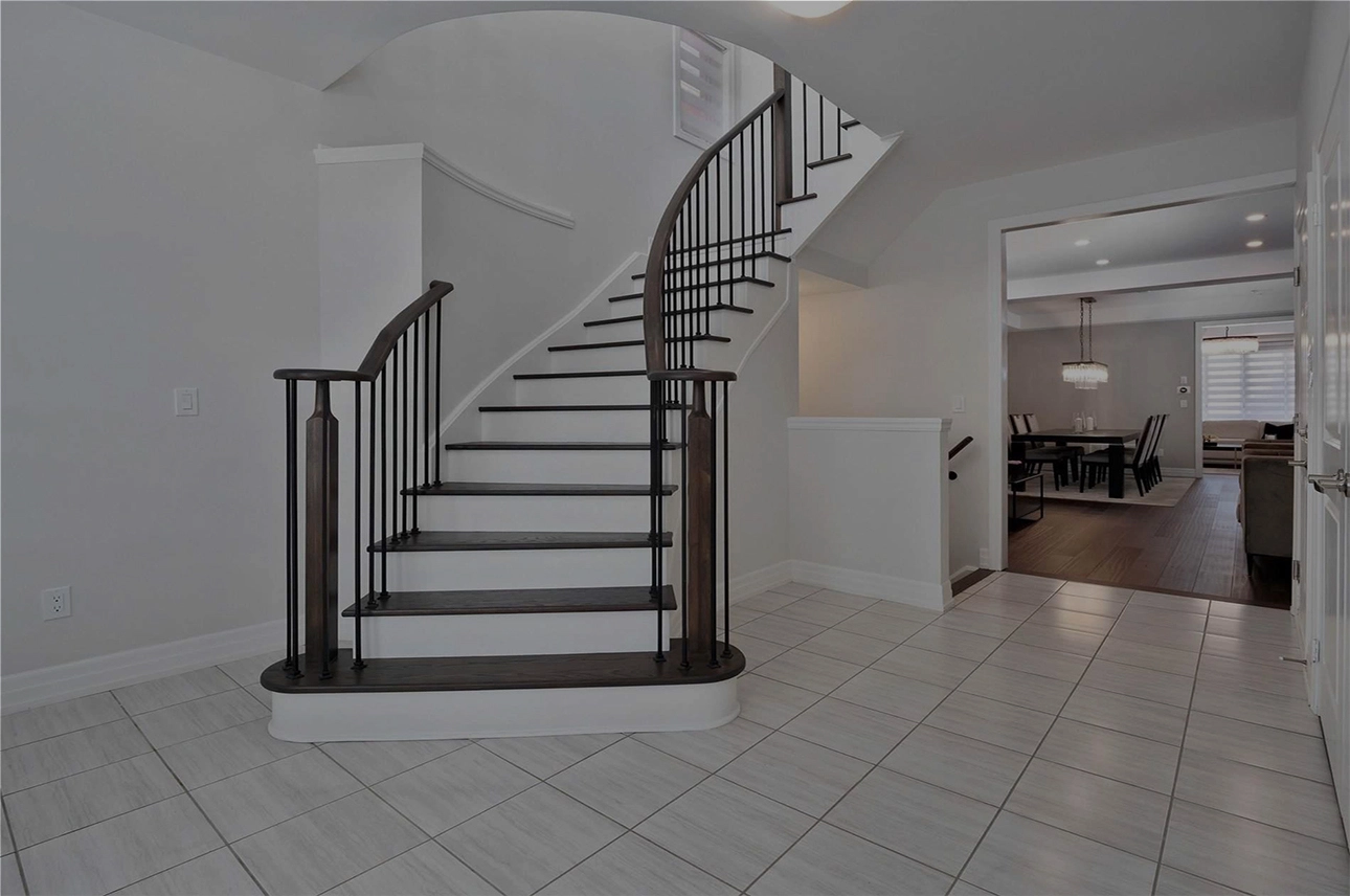 Photo - Cloverridge project with renovated dark oak stairs and ceramic tiles