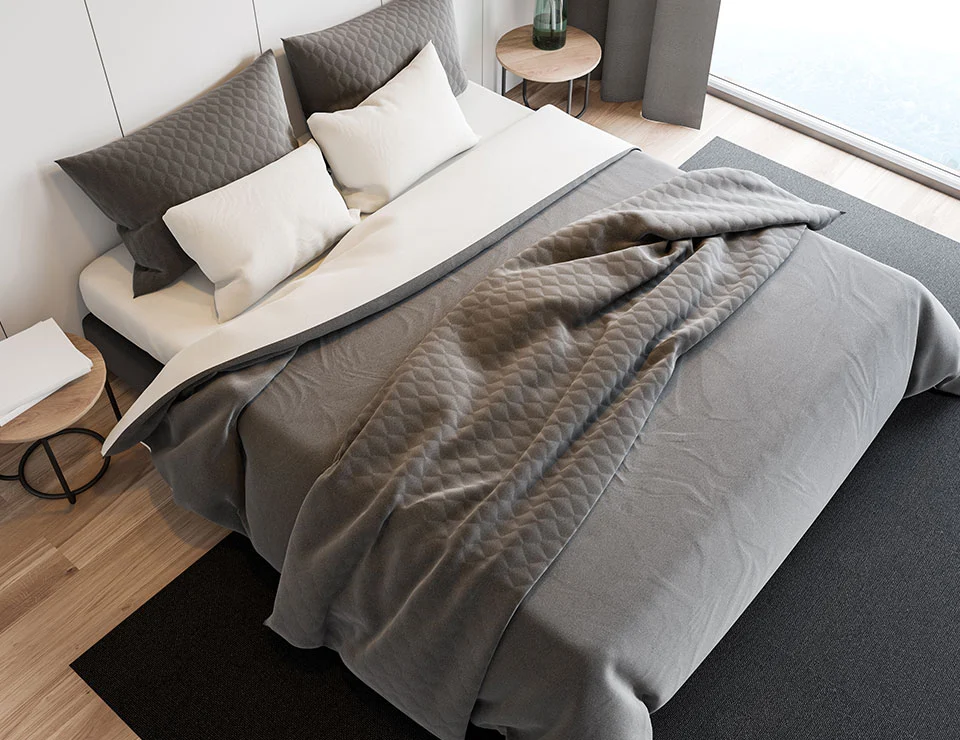 Photo - renovated bedroom with modern grey bed coverings